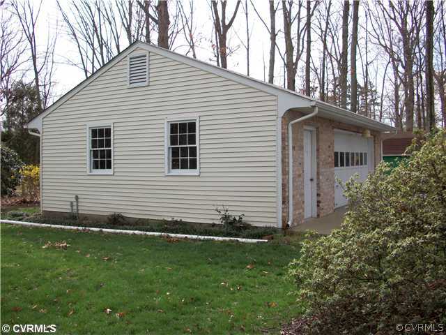 2541 Radstock Road Midlothian, VA 23113 - Photo 8 of 12 a front view of a house with a garden