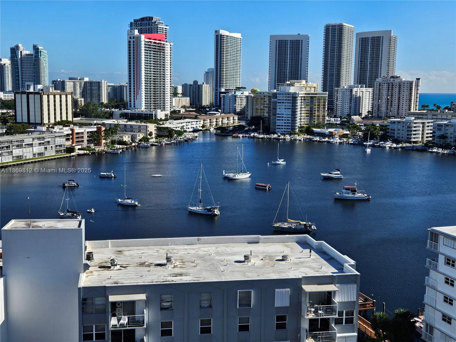427 Golden Isles Drive, Unit 16E Hallandale Beach, FL 33009 - Photo 2 of 17 a view of a city with tall buildings