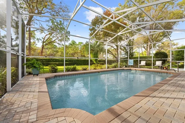 a view of a swimming pool with seating area