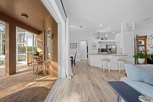 a kitchen with stainless steel appliances granite countertop a stove a sink and white cabinets