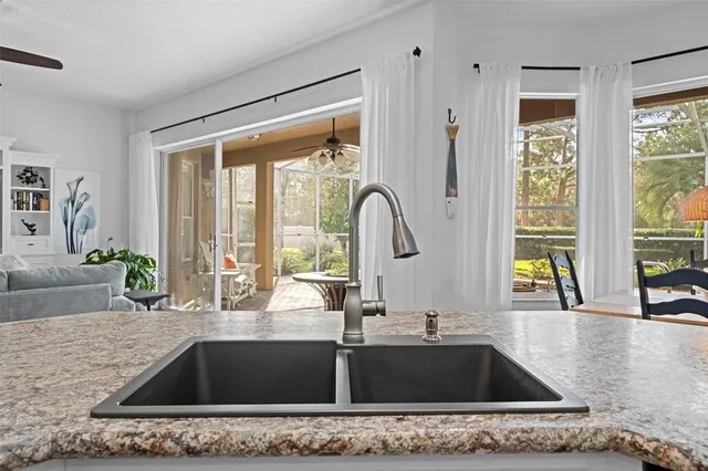 a view of a hallway with wooden floor and entryway
