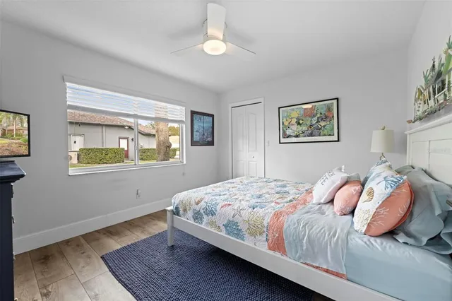a view of a workspace with furniture window and wooden floor