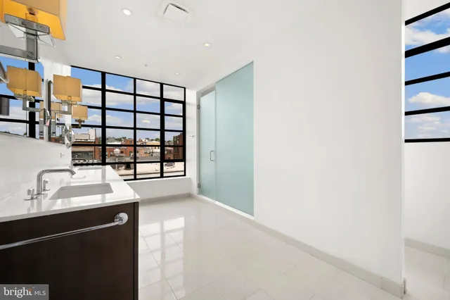 a bathroom with a double vanity sink mirror and