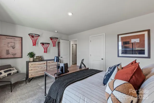 a bedroom with a bed and furniture