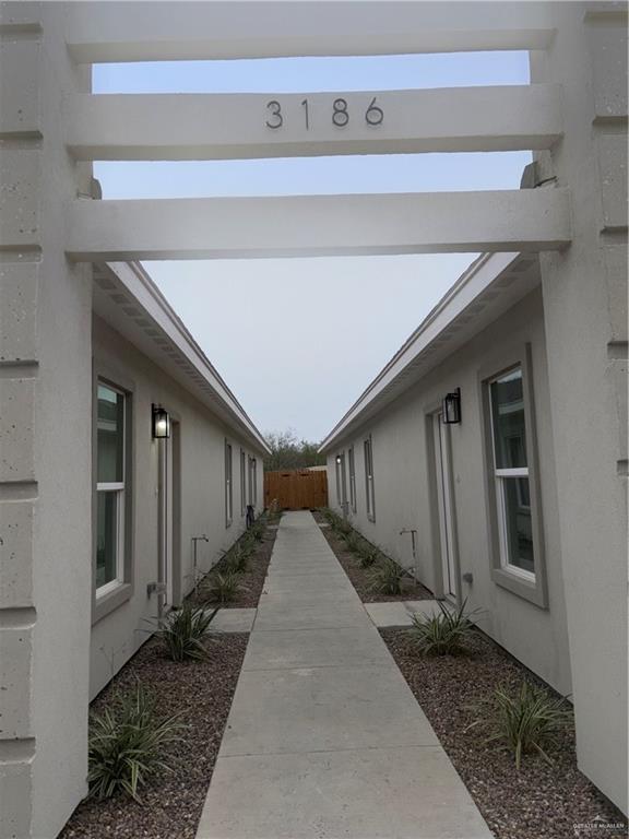 3186 Briggs Road, Unit 2 Weslaco, TX 78596 - Photo 2 of 19 a view of a back yard of the house