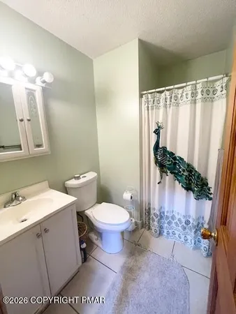 a bedroom with bed and window