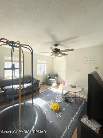 a bed sitting in a bedroom next to a window