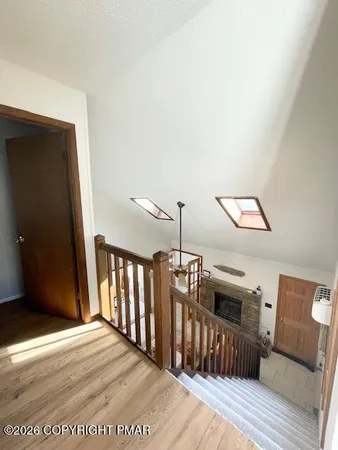 a bedroom with two beds and a window