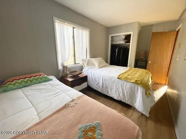 a living room with a couch a rug and a large window