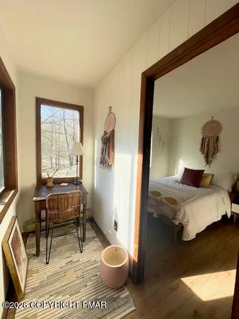 a bathroom with a toilet and a mirror