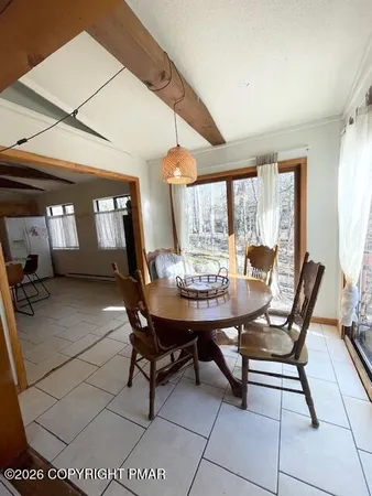 a bedroom with a bed ceiling fan and a window