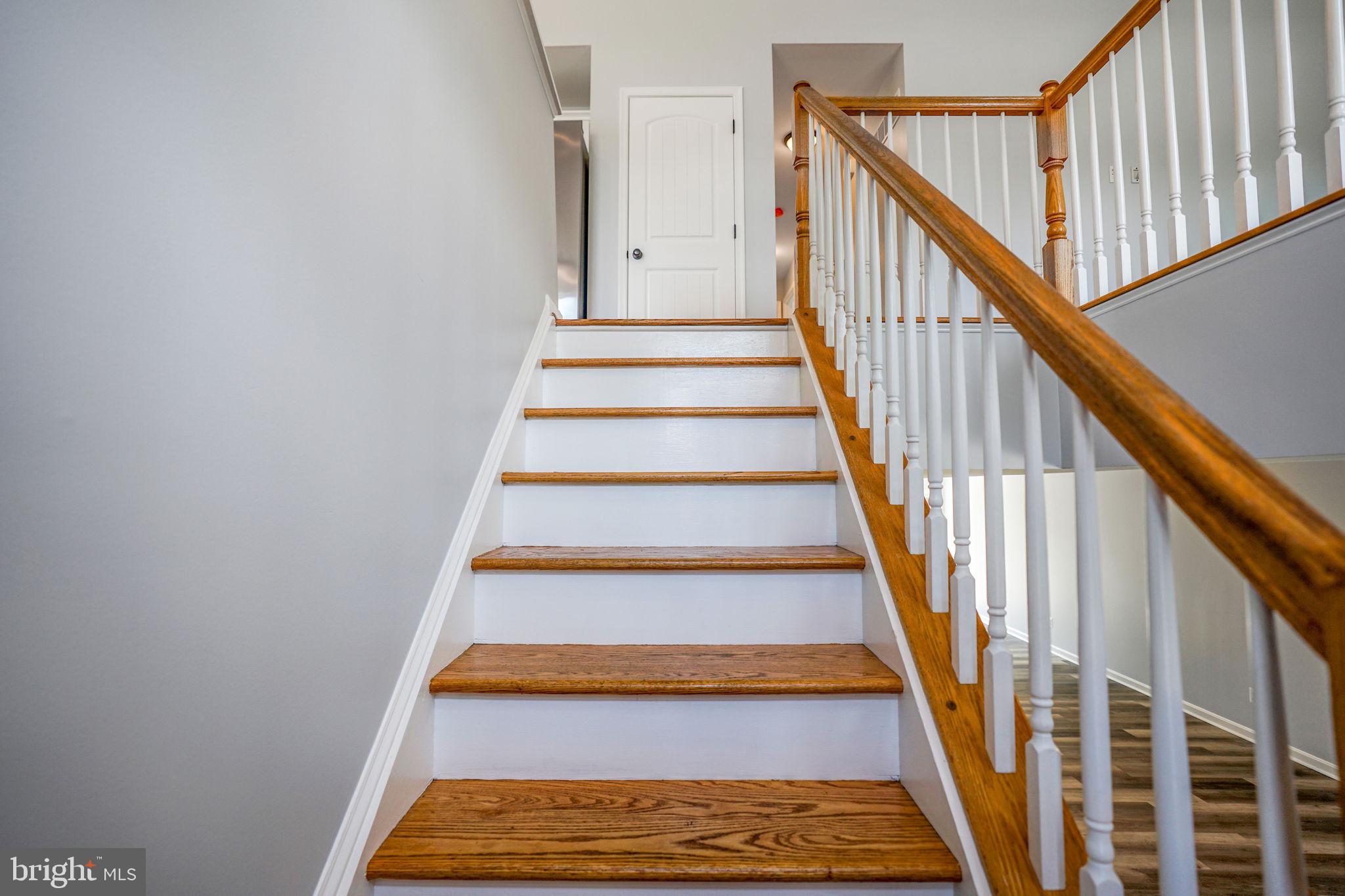 115 Meadow Road Pasadena, MD 21122 - Photo 14 of 77 Upper Level Hardwood Stairs