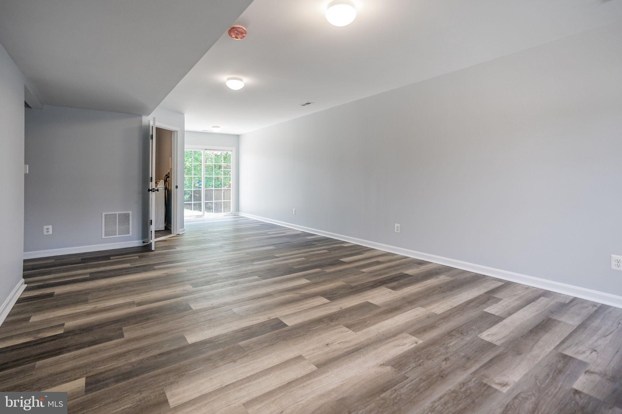 115 Meadow Road Pasadena, MD 21122 - Photo 55 of 77 Lower level Family Room