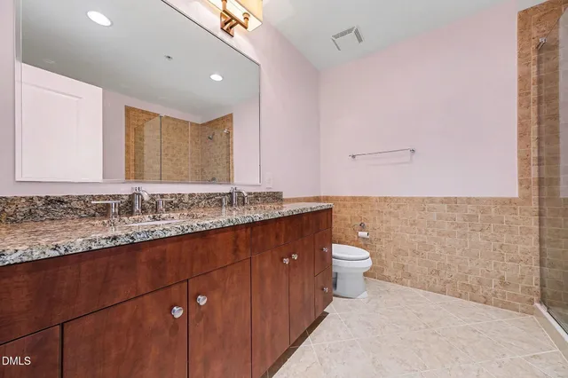 a bathroom with a bathtub and shower