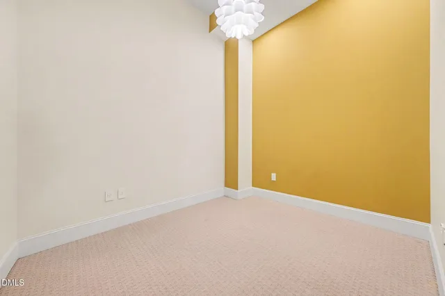 a view of a big room with windows and closet