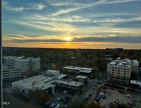 a living room with furniture and large windows