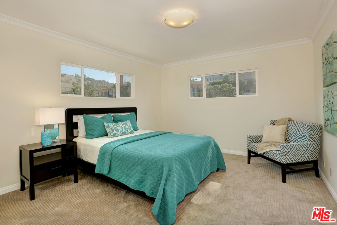 3838 Crestview Road Culver City, CA 90232 - Photo 20 of 29 a bedroom with a bed chair and a couch