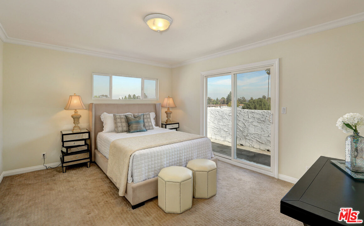 3838 Crestview Road Culver City, CA 90232 - Photo 23 of 29 a bedroom with a bed and a window