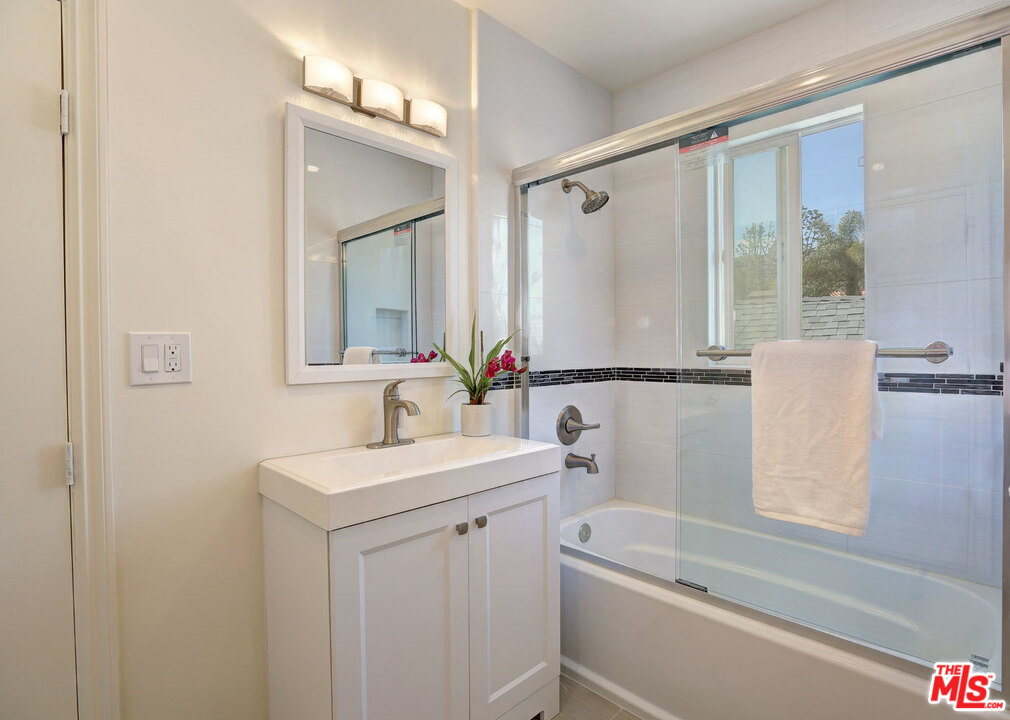 3838 Crestview Road Culver City, CA 90232 - Photo 24 of 29 a bathroom with a sink and a mirror