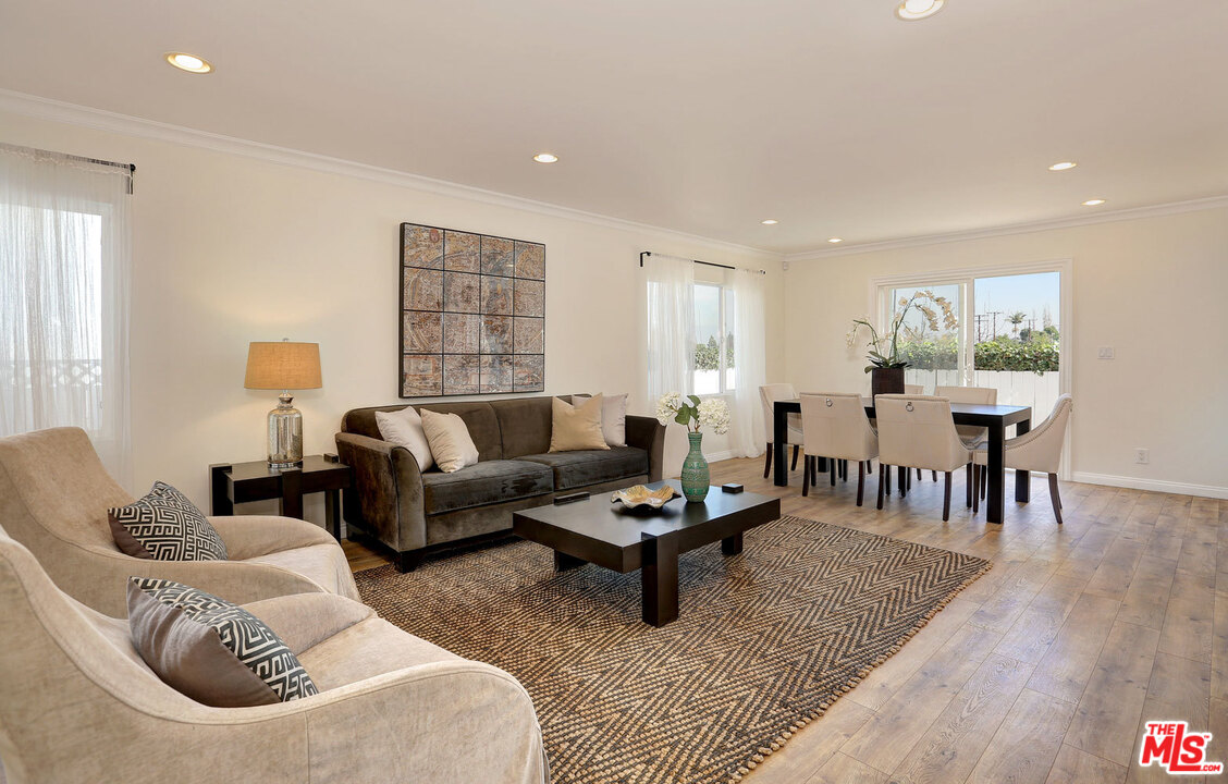 3838 Crestview Road Culver City, CA 90232 - Photo 5 of 29 a living room with furniture and wooden floor