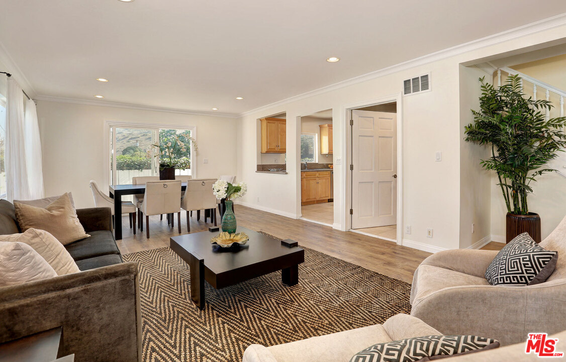3838 Crestview Road Culver City, CA 90232 - Photo 7 of 29 a living room with furniture and a large window