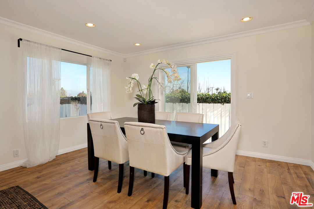 3838 Crestview Road Culver City, CA 90232 - Photo 10 of 29 a view of a dining room with furniture and wooden floor