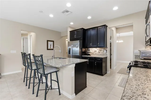 a spacious bathroom with a tub sink and mirror