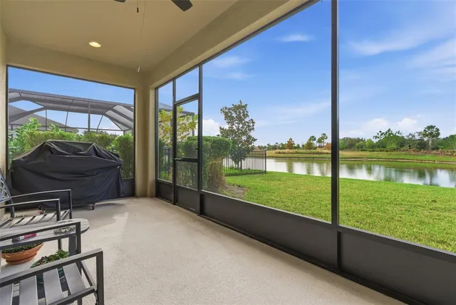 a spacious bedroom with a bed and a tv