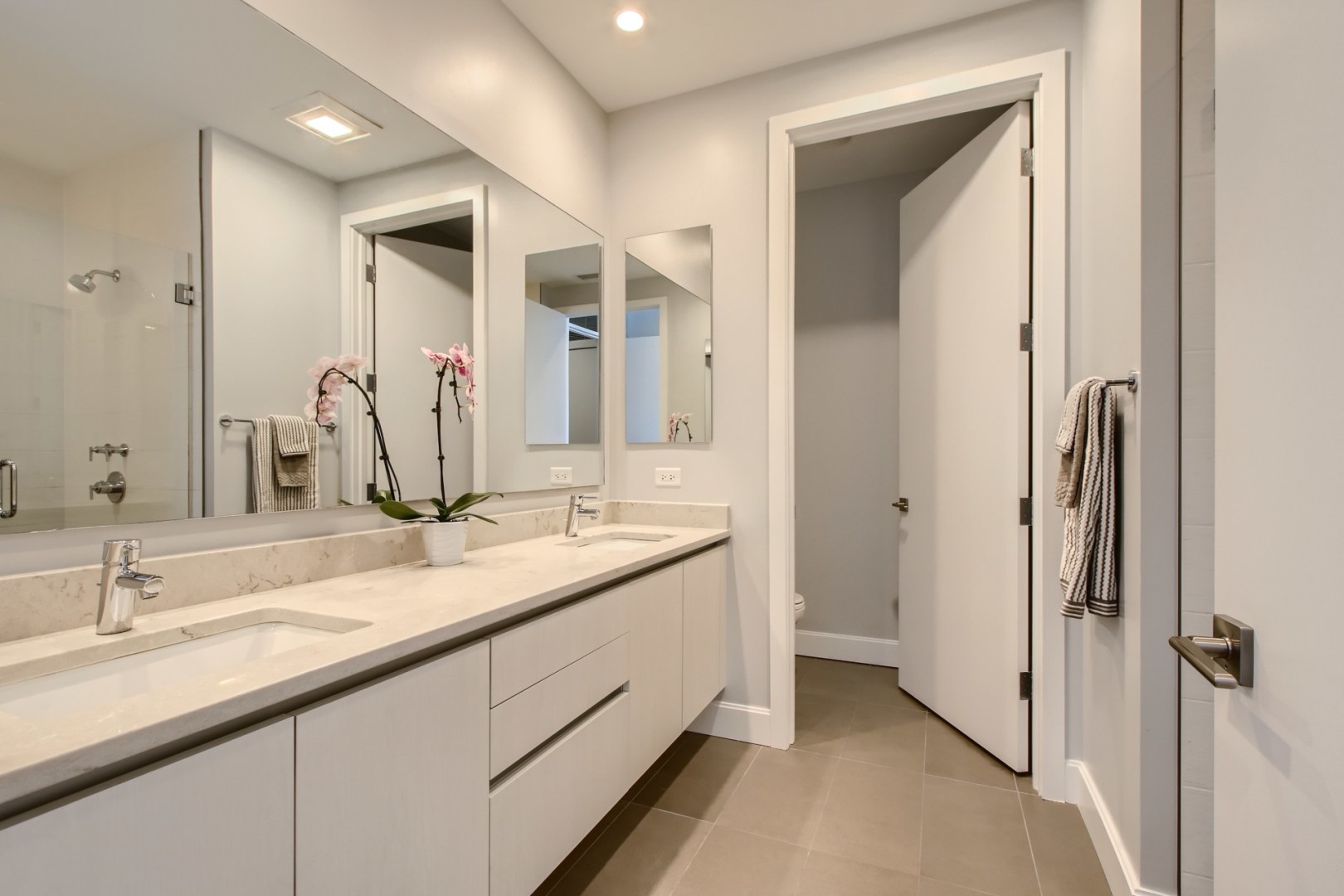 31 North Aberdeen Street, Unit PHS Chicago, IL 60607 - Photo 13 of 28 a bathroom with a double vanity sink and a mirror
