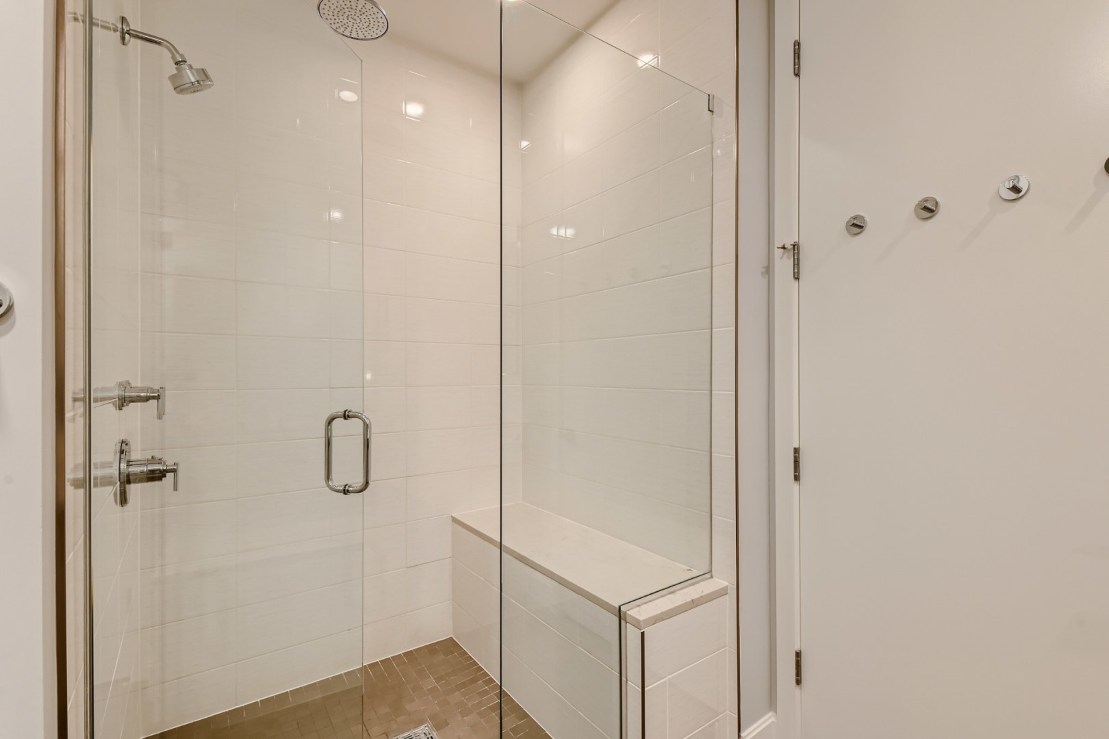 31 North Aberdeen Street, Unit PHS Chicago, IL 60607 - Photo 15 of 28 a bathroom with a shower and a glass door