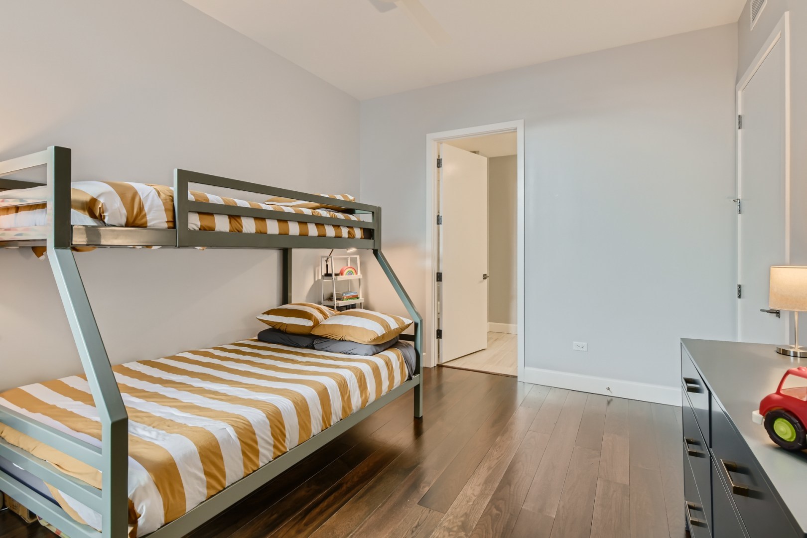 31 North Aberdeen Street, Unit PHS Chicago, IL 60607 - Photo 17 of 28 a bedroom with a bed and wooden floor