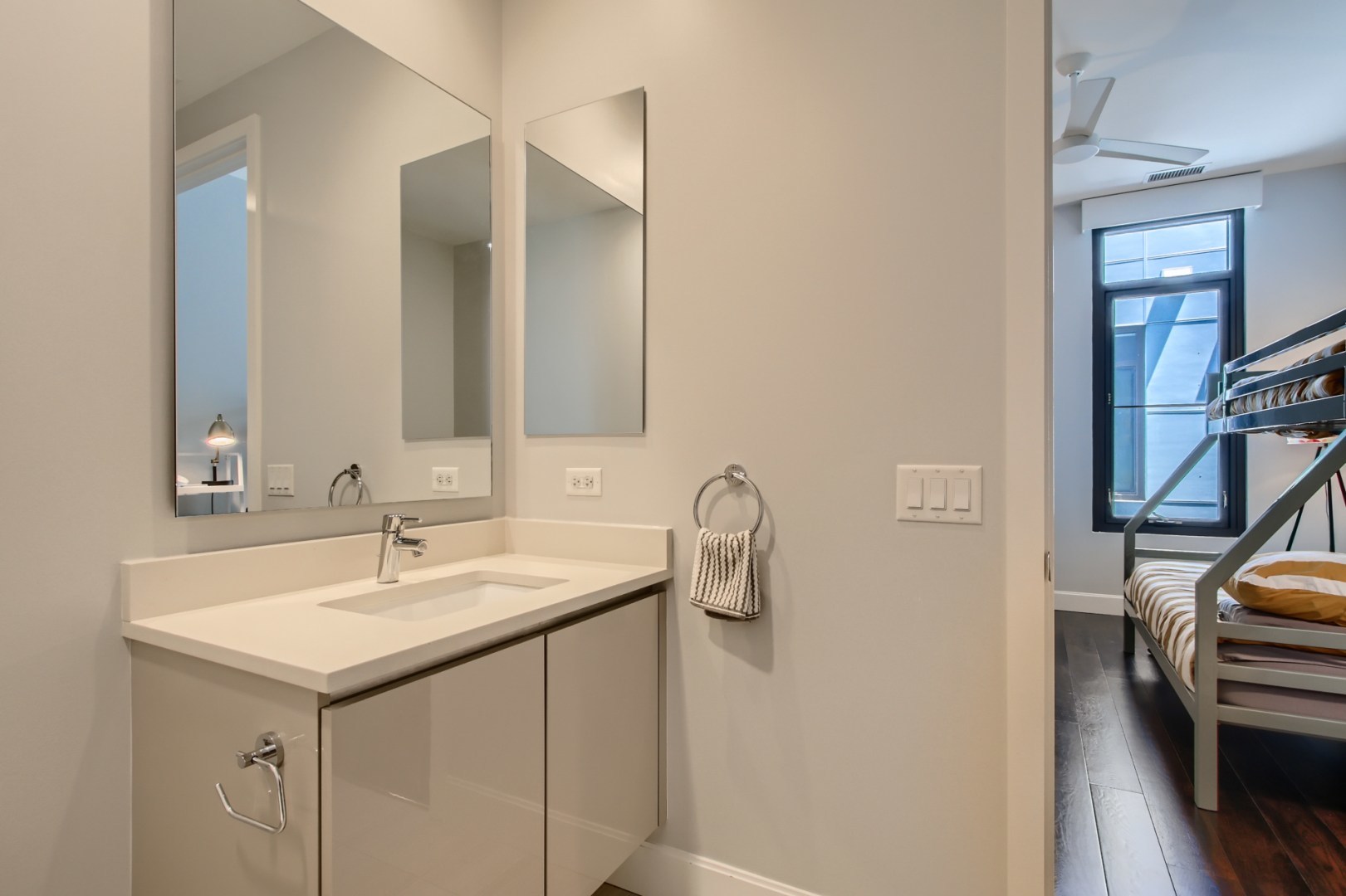 31 North Aberdeen Street, Unit PHS Chicago, IL 60607 - Photo 18 of 28 a bathroom with a sink and a mirror