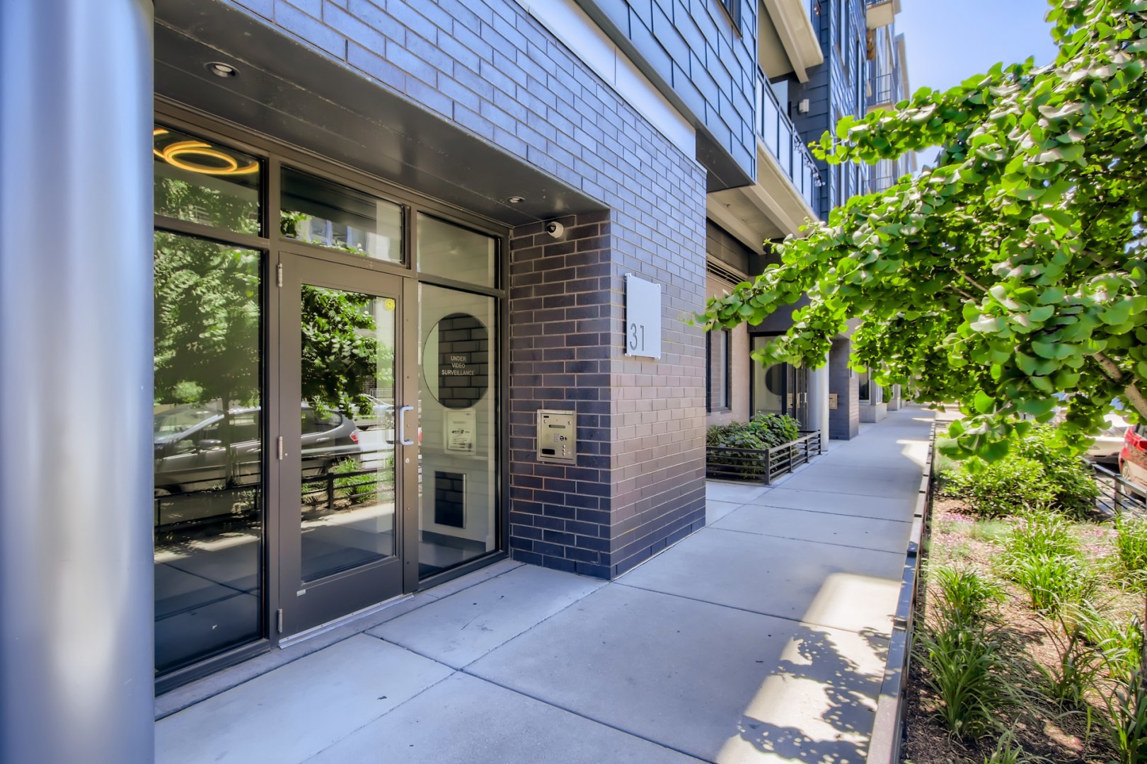 31 North Aberdeen Street, Unit PHS Chicago, IL 60607 - Photo 2 of 28 a front view of a house with a yard