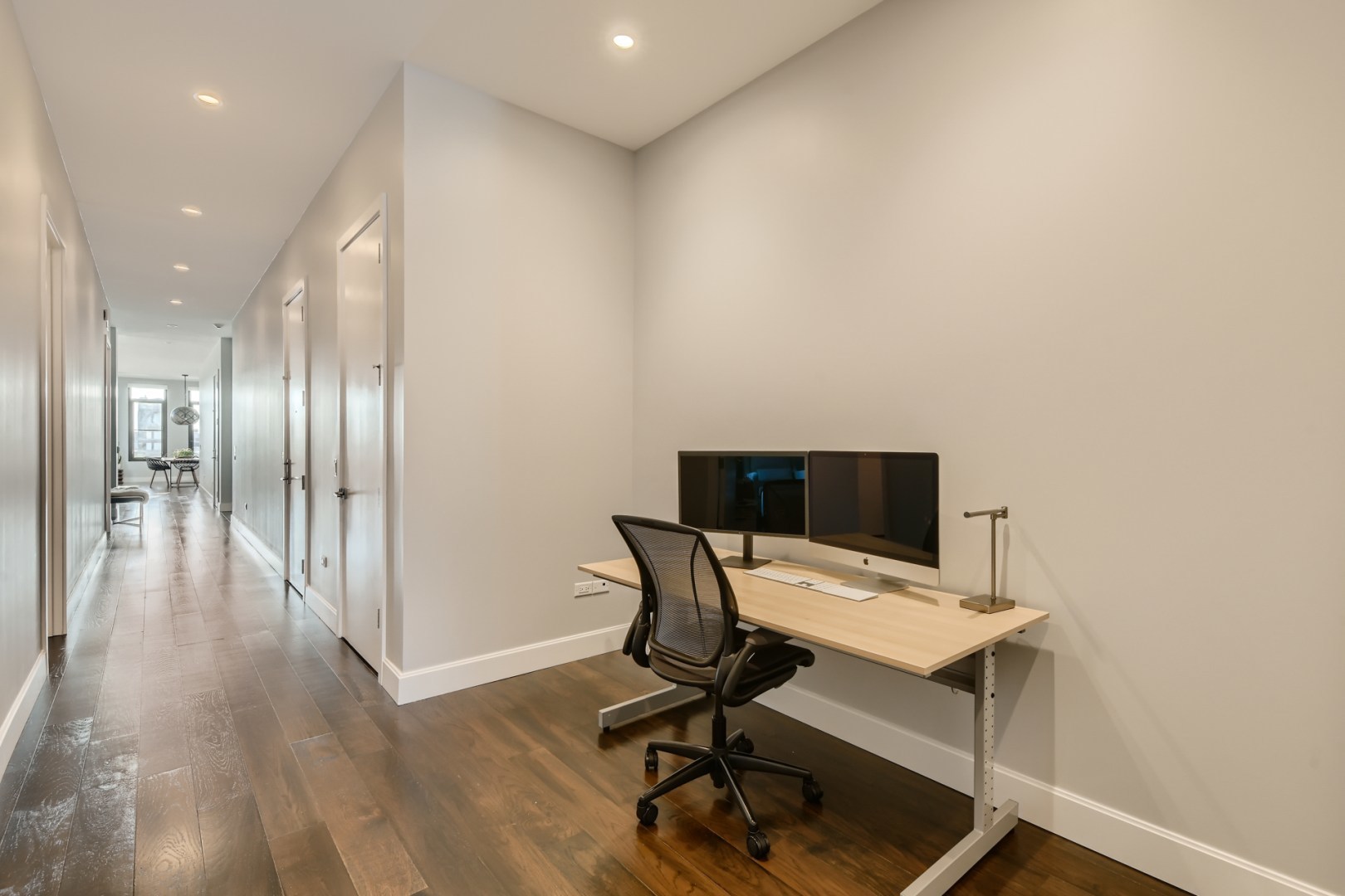 31 North Aberdeen Street, Unit PHS Chicago, IL 60607 - Photo 21 of 28 a view of a workspace with furniture and wooden floor