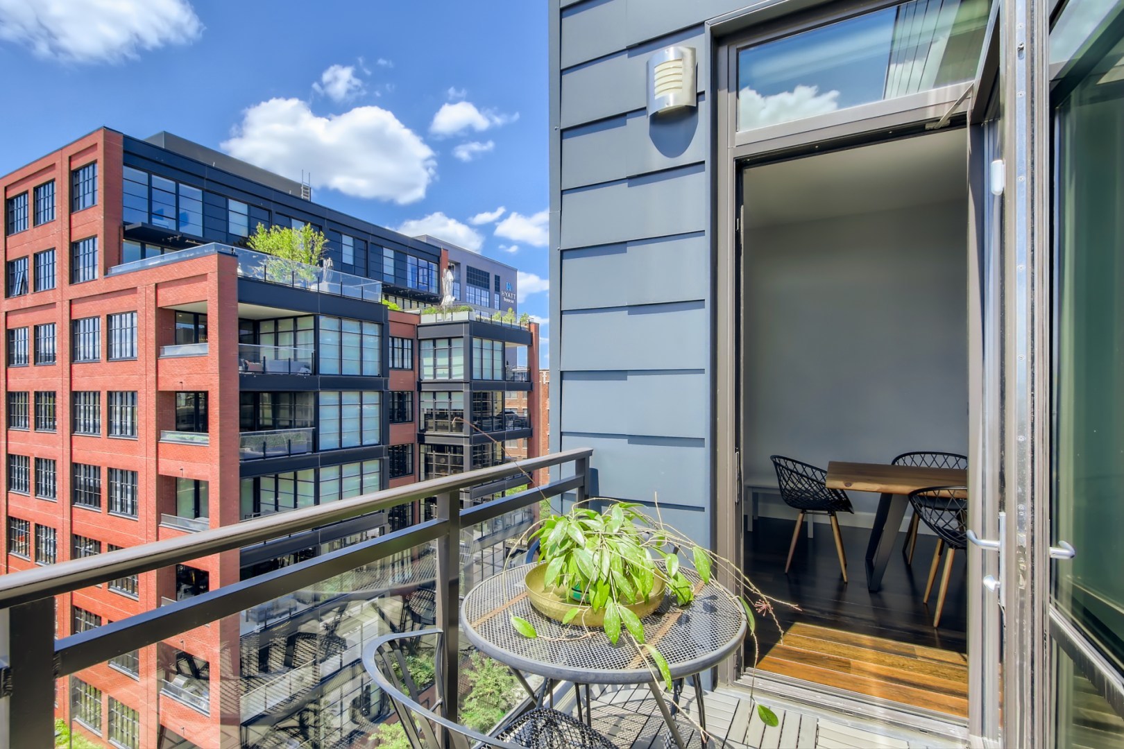 31 North Aberdeen Street, Unit PHS Chicago, IL 60607 - Photo 23 of 28 a view of a chairs and table in a balcony