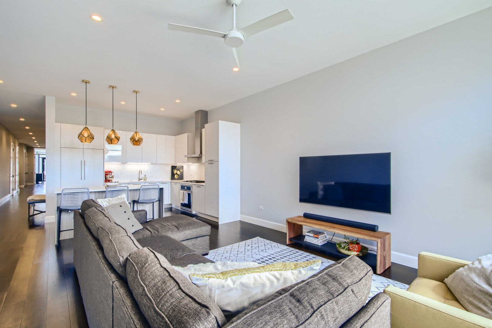 31 North Aberdeen Street, Unit PHS Chicago, IL 60607 - Photo 5 of 28 a living room with furniture and a flat screen tv