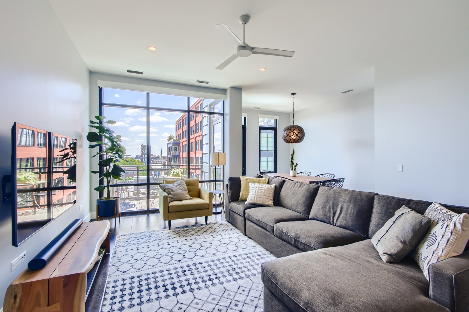 31 North Aberdeen Street, Unit PHS Chicago, IL 60607 - Photo 6 of 28 a living room with furniture and a window