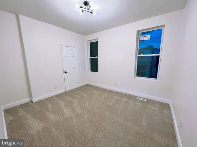 an empty room with a bathroom