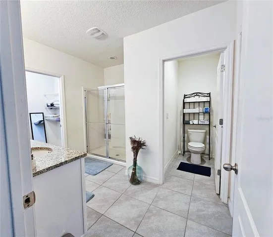 a bedroom with a bed and a closet