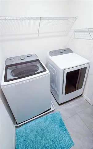 a view of an ocean with a table and chair