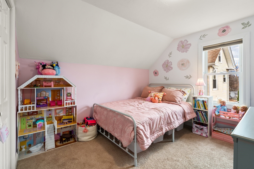 10 Cedar Street Hudson, MA 01749 - Photo 17 of 38 a bedroom with a bed and a window