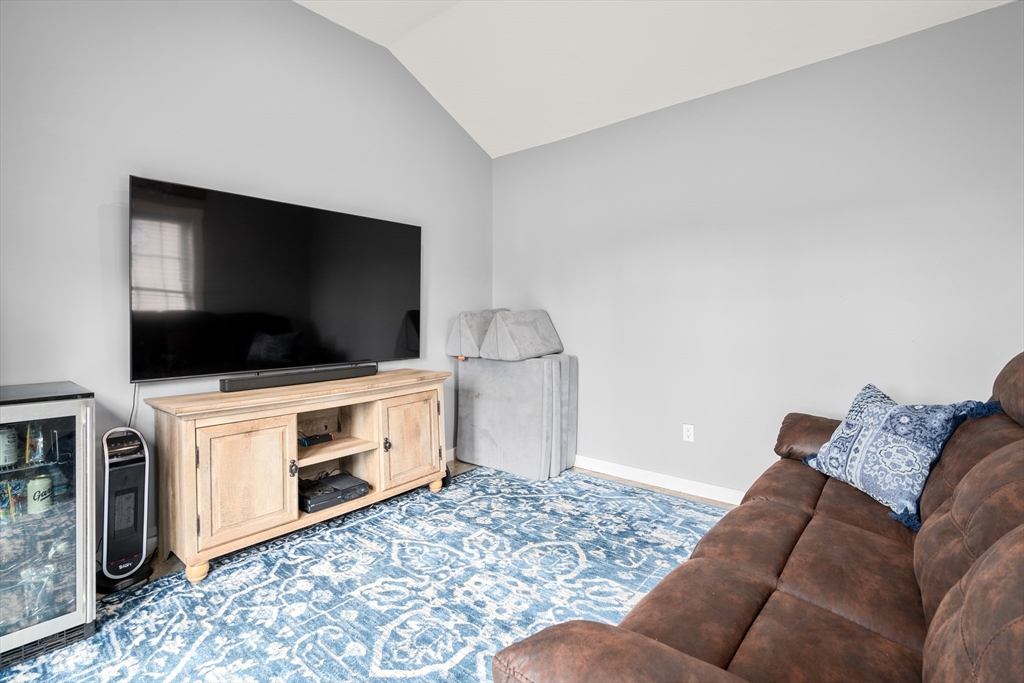 10 Cedar Street Hudson, MA 01749 - Photo 24 of 38 a living room with furniture and a flat screen tv