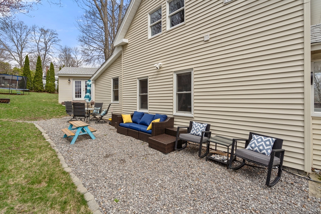 10 Cedar Street Hudson, MA 01749 - Photo 35 of 38 a view of a house with backyard and sitting area