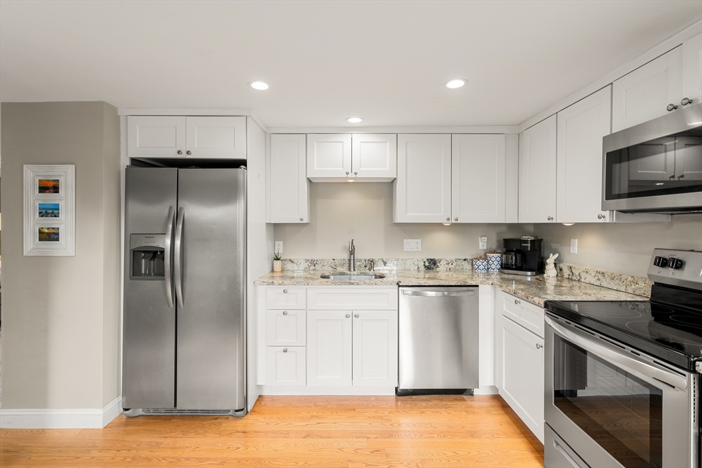 10 Cedar Street Hudson, MA 01749 - Photo 4 of 38 a kitchen with a refrigerator stove and microwave