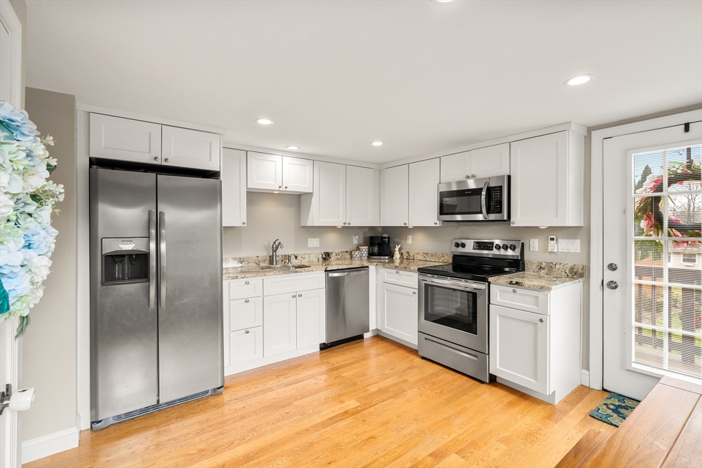 10 Cedar Street Hudson, MA 01749 - Photo 5 of 38 a kitchen with a refrigerator stove and microwave