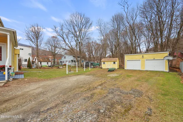 a view of a house with basketball court