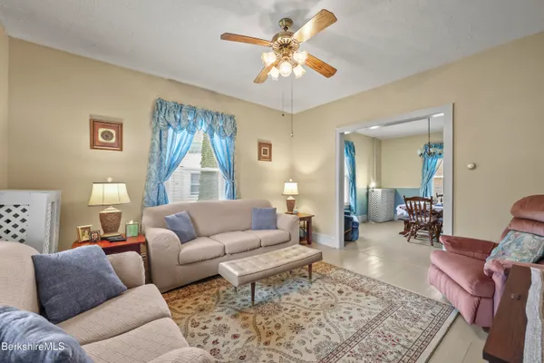 a living room with furniture and a rug