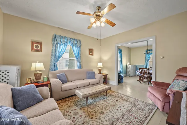 a living room with furniture and a rug