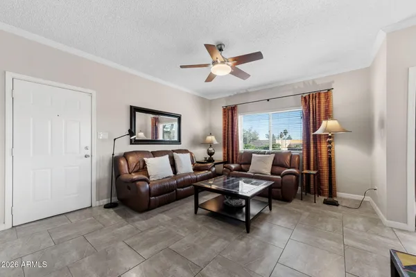 a living room with furniture and a window