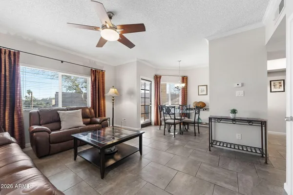 a living room with furniture and a large window